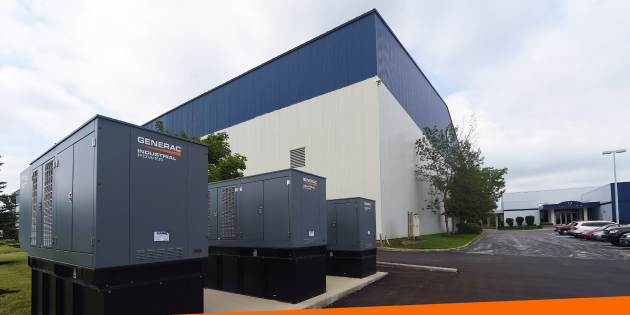 Three industrial-grade Generac generators outside an Ohio facility, showing the scale of commercial backup power work Great Lakes Electric takes on.