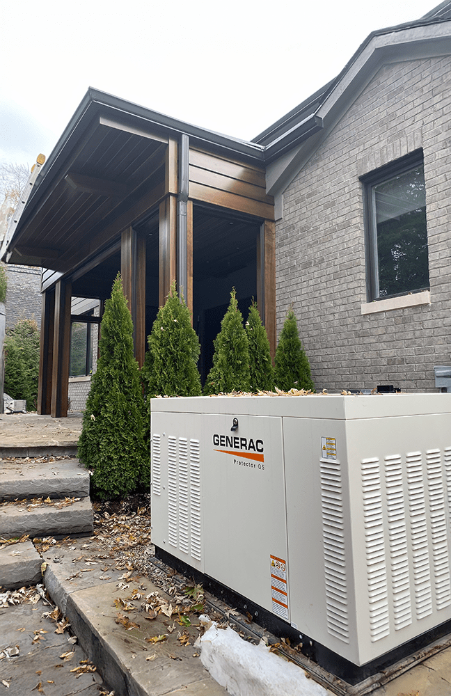 A Generac Protector QS generator sitting at the entrance of a business, quietly ready for when the power goes out in Northern Ohio.