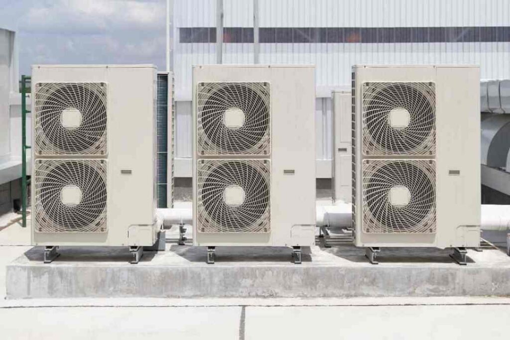 Three large HVAC condensers mounted on an Ohio commercial rooftop by Great Lakes Electric.